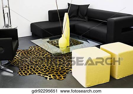 Showpieces on a table with a couch View Large Photo Image Stock Image - Showpieces on a table with a couch. Fotosearch