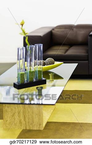 Showpieces on a table with a couch View Large Photo Image Stock Photo - Showpieces on a table with a couch. Fotosearch