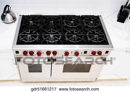 Stove in a kitchen View Large Photo Image Stock Photo - Stove in a kitchen. Fotosearch