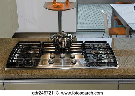 Stove on a kitchen counter View Large Photo Image Stock Image - Stove on a kitchen counter. Fotosearch
