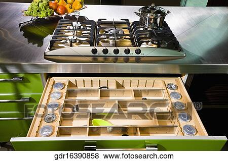 Stove with an open drawer in the kitchen View Large Photo Image Stock Photo - Stove with an open drawer in the kitchen. Fotosearch