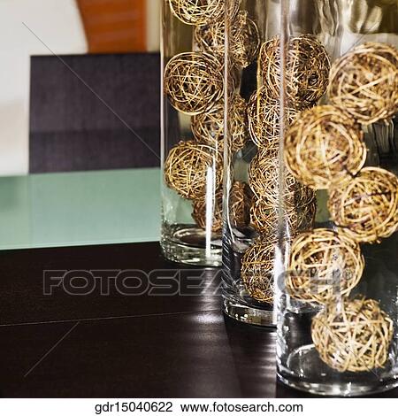 Straw balls in glasses on a dining table View Large Photo Image Stock Image - Straw balls in glasses on a dining table. Fotosearch