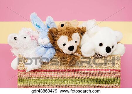 Stuffed toys in a basket View Large Photo Image Stock Photo - Stuffed toys in a basket. Fotosearch
