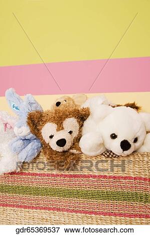 Stuffed toys in a basket View Large Photo Image Stock Photo - Stuffed toys in a basket. Fotosearch