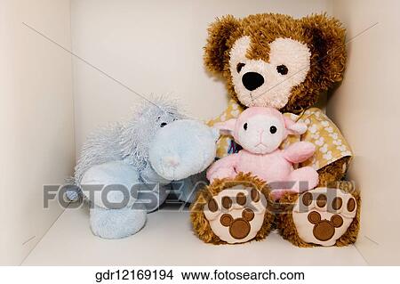 Stuffed toys on a shelf View Large Photo Image Picture - Stuffed toys on a shelf. Fotosearch