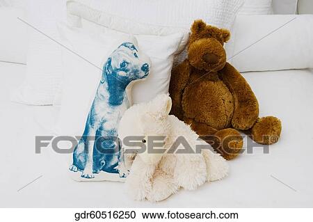 Stuffed toys on the bed View Large Photo Image Stock Image - Stuffed toys on the bed. Fotosearch