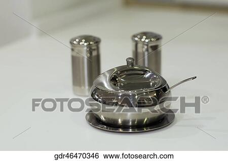 Sugar container with salt shaker and pepper shaker on a kitchen counter View Large Photo Image Stock Photograph - Sugar container with salt shaker and pepper shaker on a kitchen counter. Fotosearch