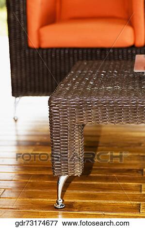 Stock Photo - Table and an armchair on the patio. Fotosearch