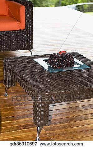 Stock Photo - Table and an armchair on the patio. Fotosearch