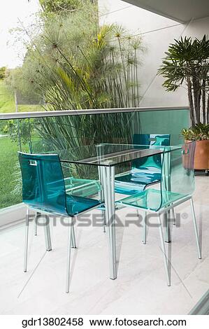 Stock Photo - Table and chairs on the patio. Fotosearch