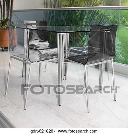 Stock Photo - Table and chairs on the patio. Fotosearch