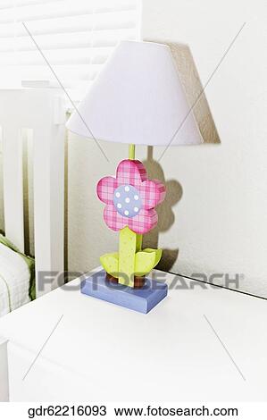 Table lamp on a side table View Large Photo Image Stock Image - Table lamp on a side table. Fotosearch