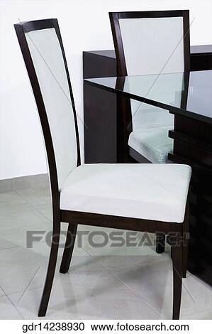 Table with chairs in a dining room View Large Photo Image Stock Image - Table with chairs in a dining room. Fotosearch