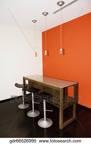 Table with stools in a home View Large Photo Image Stock Photography - Table with stools in a home. Fotosearch
