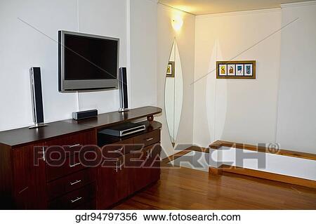 Television mounted over a sideboard View Large Photo Image Stock Photograph - Television mounted over a sideboard. Fotosearch
