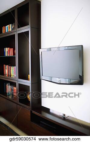 Television with a bookshelf View Large Photo Image Picture - Television with a bookshelf. Fotosearch