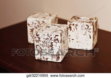 Three candles on a table View Large Photo Image Stock Photography - Three candles on a table. Fotosearch