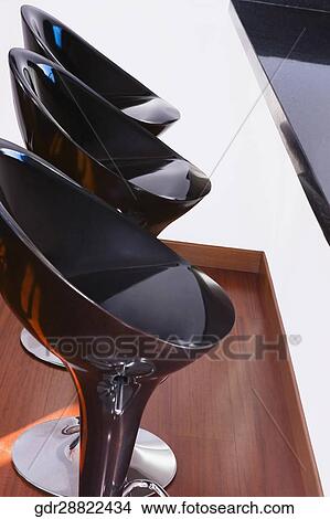 Picture - Three chairs in a row. Fotosearch