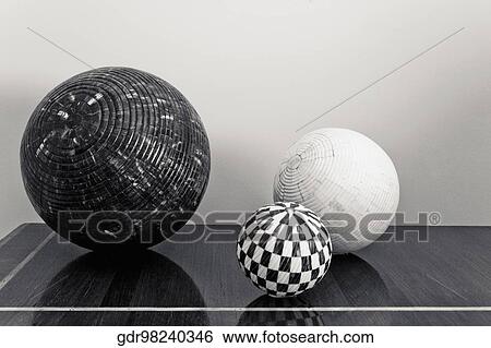 Three decorative balls on a chest View Large Photo Image Stock Photograph - Three decorative balls on a chest. Fotosearch