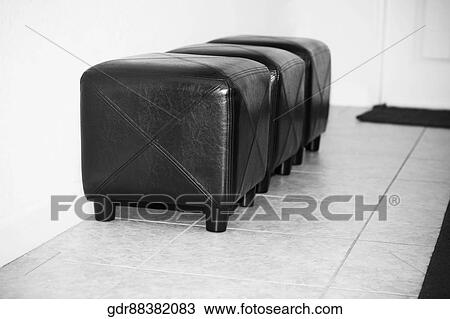 Three ottomans in a living room View Large Photo Image Stock Image - Three ottomans in a living room. Fotosearch