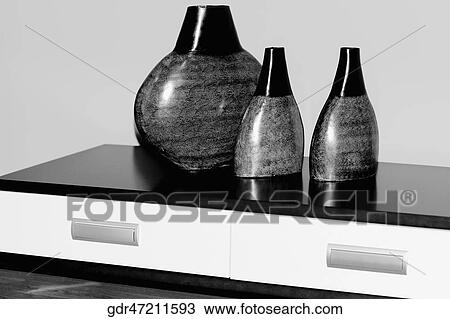 Three vases on a sideboard View Large Photo Image Stock Image - Three vases on a sideboard. Fotosearch