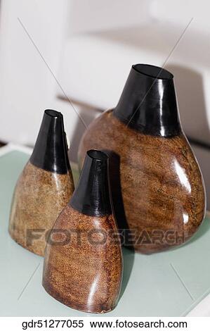 Three vases on a table View Large Photo Image Stock Photography - Three vases on a table. Fotosearch