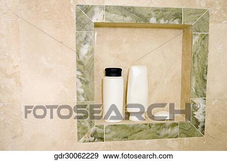 Toiletries in an alcove in the bathroom View Large Photo Image Stock Photo - Toiletries in an alcove in the bathroom. Fotosearch