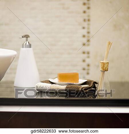 Toiletries near a wash bowl View Large Photo Image Stock Image - Toiletries near a wash bowl. Fotosearch