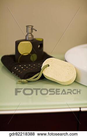 Toiletries near a wash bowl View Large Photo Image Stock Photo - Toiletries near a wash bowl. Fotosearch