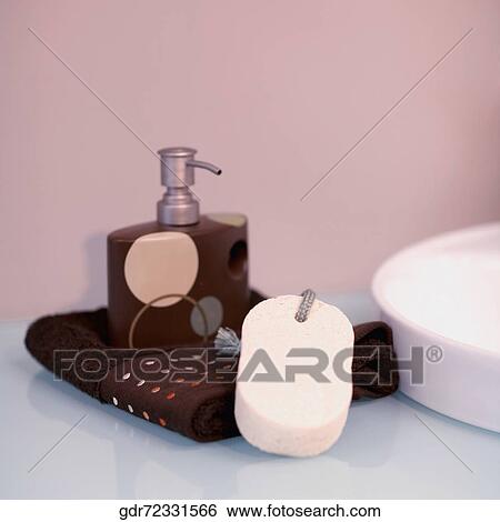 Toiletries near a wash bowl View Large Photo Image Stock Photograph - Toiletries near a wash bowl. Fotosearch