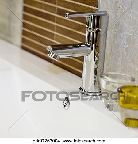 Toiletries on a bathroom sink View Large Photo Image Picture - Toiletries on a bathroom sink. Fotosearch