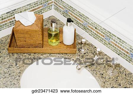 Toiletries on a bathroom sink View Large Photo Image Stock Image - Toiletries on a bathroom sink. Fotosearch