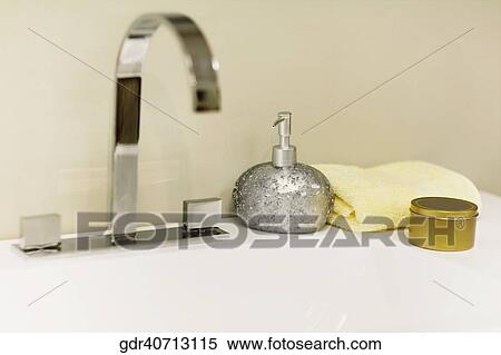 Toiletries on a bathroom sink View Large Photo Image Stock Photography - Toiletries on a bathroom sink. Fotosearch