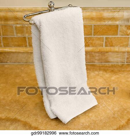 Towel hanging on the towel rail View Large Photo Image Stock Photograph - Towel hanging on the towel rail. Fotosearch