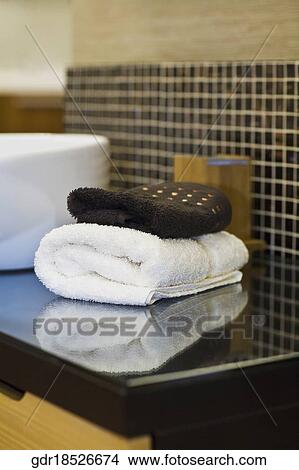 Picture - Towels near a wash bowl. Fotosearch