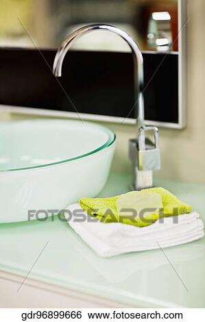 Towels near a wash bowl View Large Photo Image Stock Photograph - Towels near a wash bowl. Fotosearch