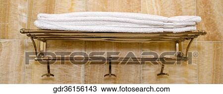 Towels on a shelf in the bathroom View Large Photo Image Stock Image - Towels on a shelf in the bathroom. Fotosearch