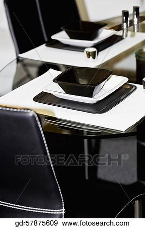 Trays and salt shakers on a dining table View Large Photo Image Stock Photo - Trays and salt shakers on a dining table. Fotosearch