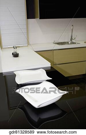 Stock Photo - Trays on a kitchen counter. Fotosearch