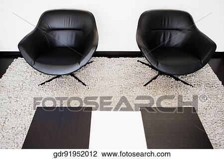 Two armchairs on a carpet View Large Photo Image Stock Image - Two armchairs on a carpet. Fotosearch