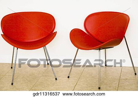 Two chairs in a living room View Large Photo Image Stock Photo - Two chairs in a living room. Fotosearch