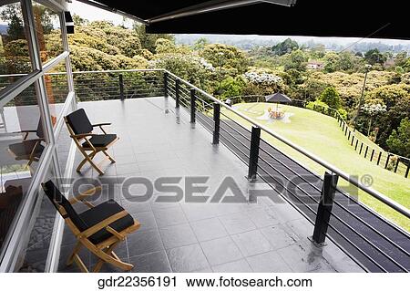 Two chairs in the balcony View Large Photo Image Stock Image - Two chairs in the balcony. Fotosearch