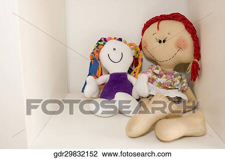 Two dolls on a shelf View Large Photo Image Stock Image - Two dolls on a shelf. Fotosearch