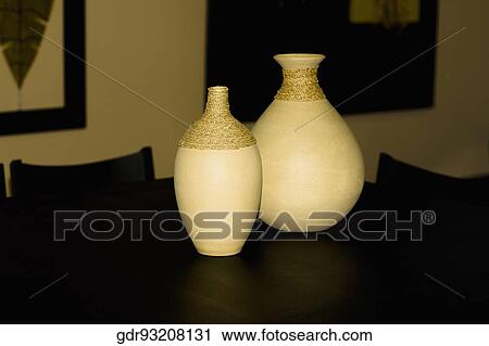 Two vases on a dining table View Large Photo Image Stock Image - Two vases on a dining table. Fotosearch