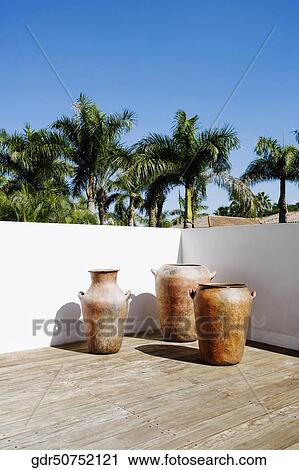 Stock Image - Urns on the balcony. Fotosearch