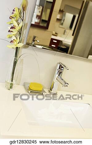 Vase and a bar of soap near a washbasin in the bathroom View Large Photo Image Stock Photography - Vase and a bar of soap near a washbasin in the bathroom. Fotosearch