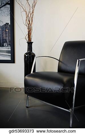 Vase beside an armchair View Large Photo Image Stock Image - Vase beside an armchair. Fotosearch