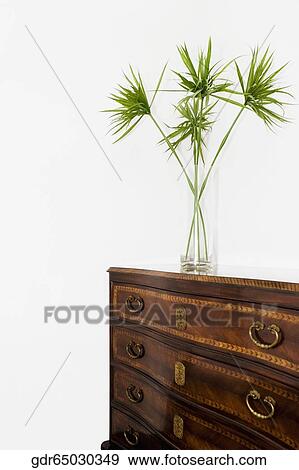 Vase on a cabinet View Large Photo Image Stock Photo - Vase on a cabinet. Fotosearch