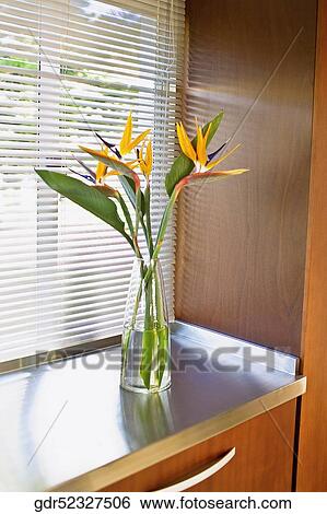 Stock Photograph - Vase on a cabinet. Fotosearch