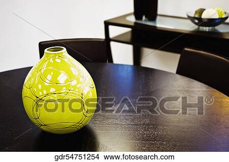 Vase on a dining table View Large Photo Image Picture - Vase on a dining table. Fotosearch